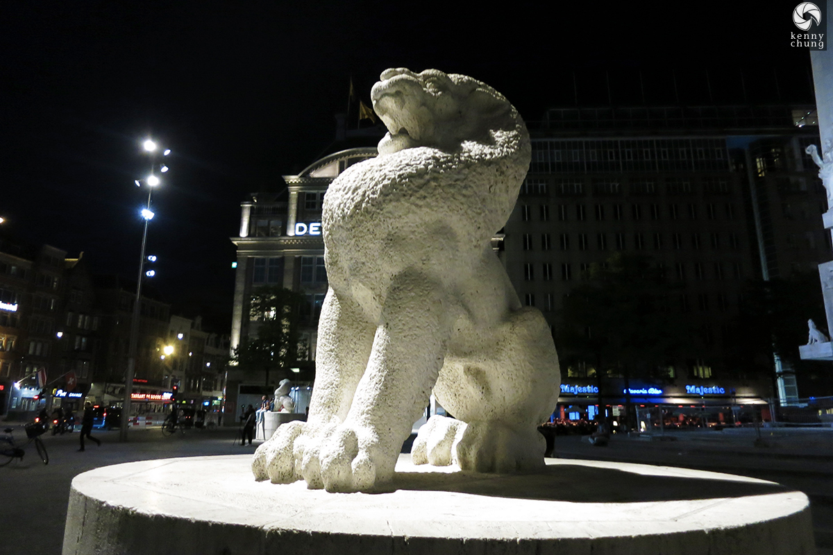 Lion statue in Dam Square, Amsterdam at night