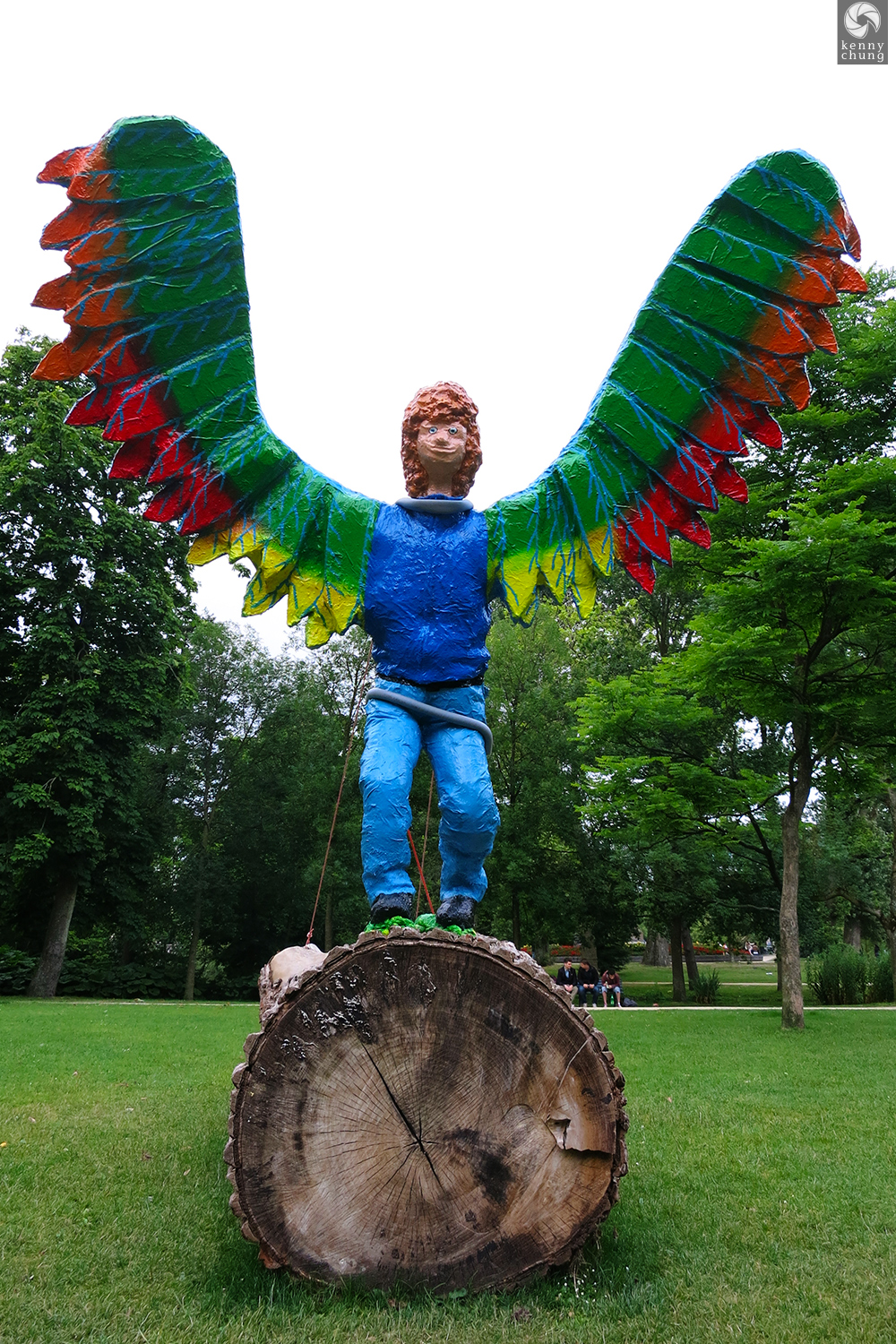 A statue of a boy with colorful wings at Vondelpark