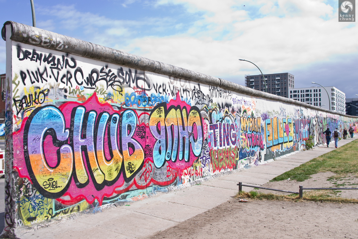 Street artist tags near a break in the Berlin Wall