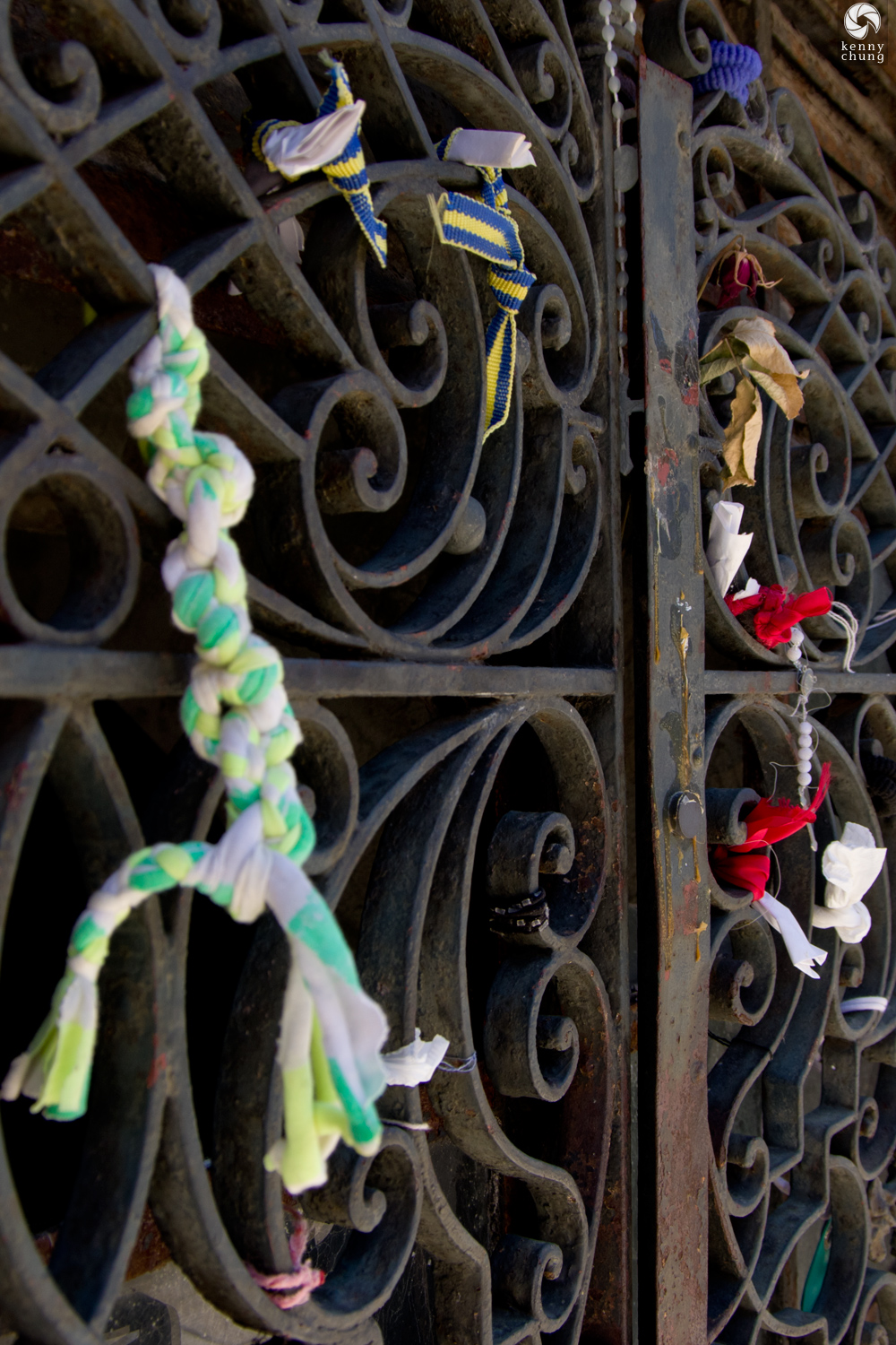 Landyards and ribbons attached to a mausoleum gate at Cementerio de La Recoleta