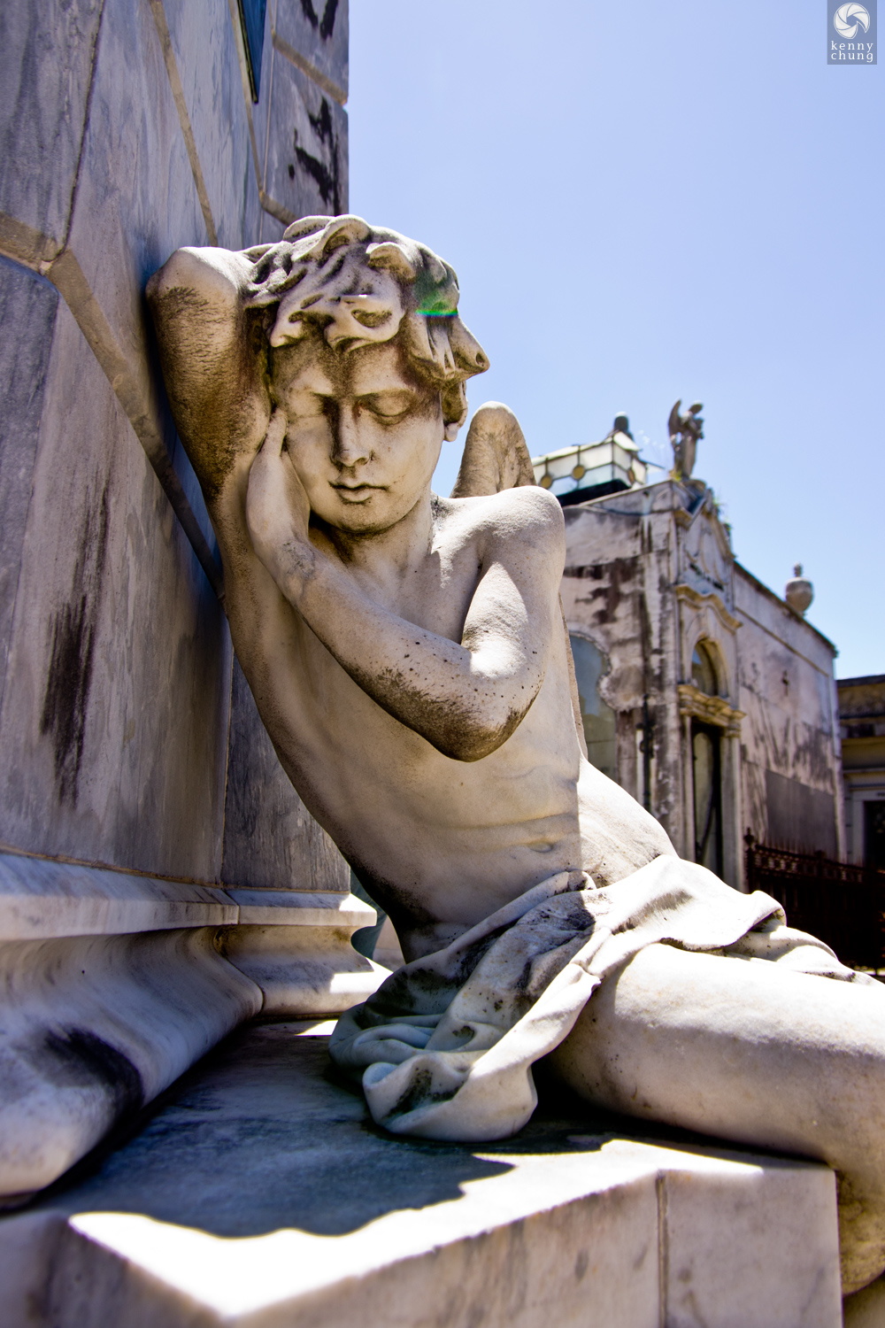 A statue of a sleeping angel at La Recoleta cemetery