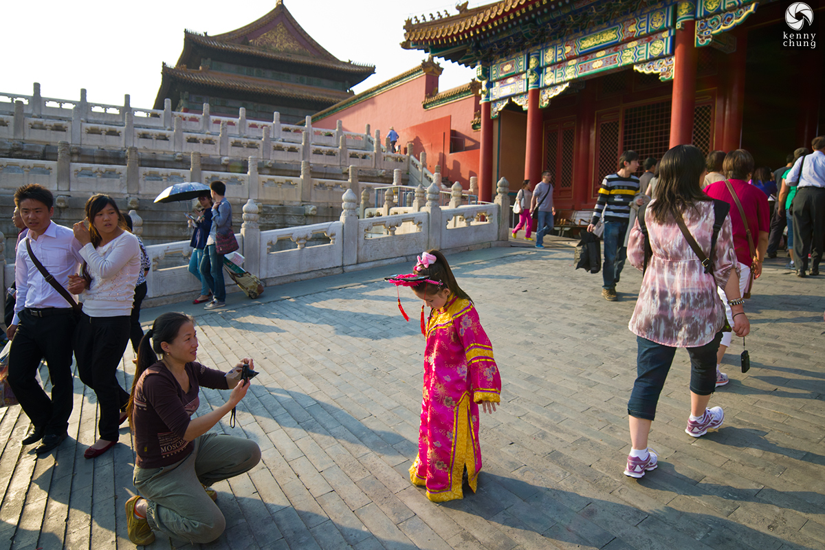 Young girl in a silk robe at the Forbidden City, Beijing