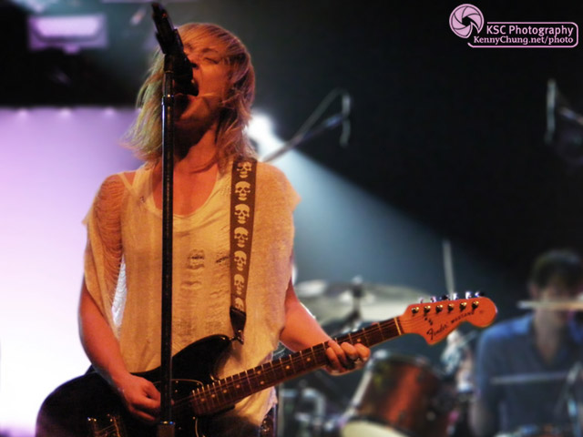 Emily Haines playing guitar