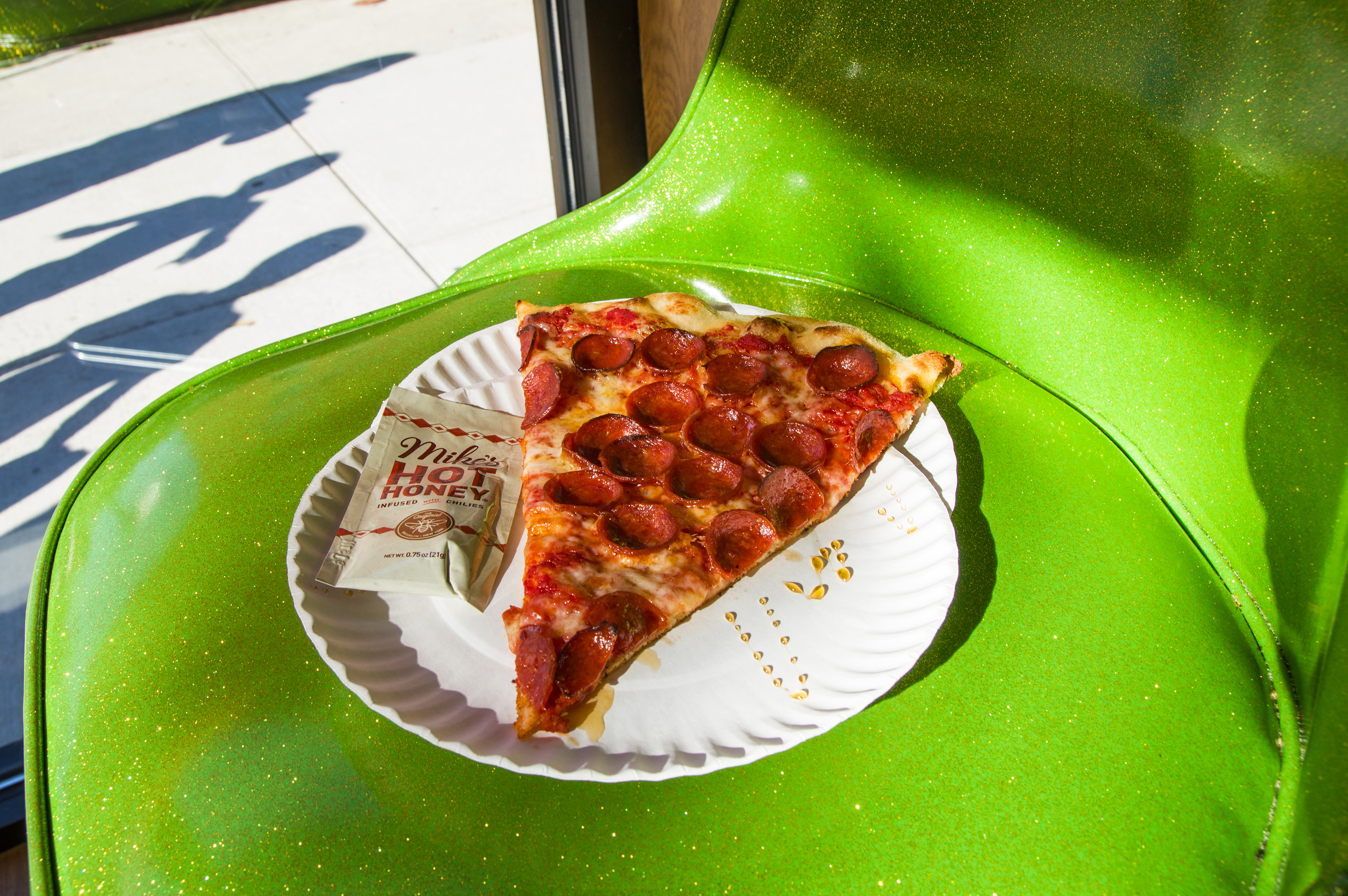 Pepperoni pizza slice with Mike's Hot Honey at Paulie Gee's Slice Shop