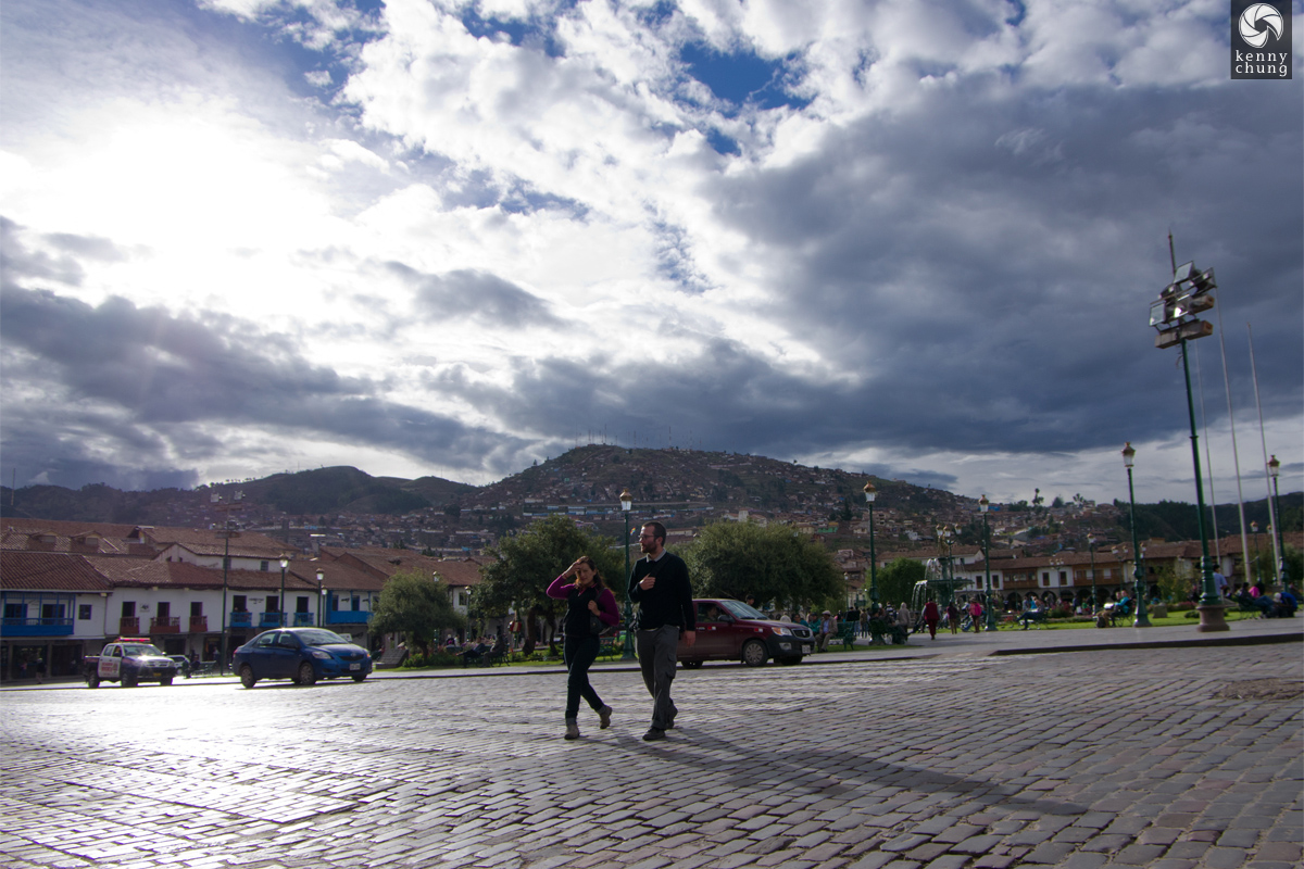 Couple crossing the street at Plaza de Armas, Cusco